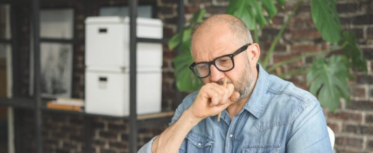 Mature adult man working from office